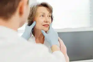 A senior woman is having her consultation at an aesthetic clinic