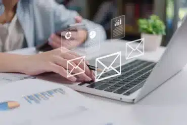 Email and digital marketing workflow with businesswoman typing on laptop.